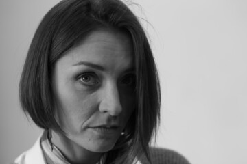 Grayscale portrait of a woman in the room