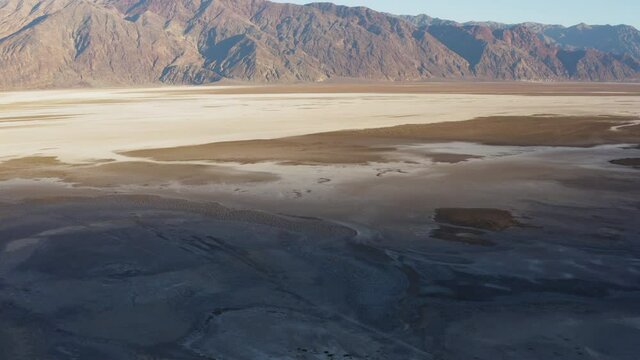 Drone flying forward over a valley in Emigrant Canyan, Devil's Middle Basin and capturing its surreal beauty. 