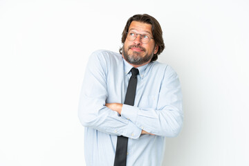 Senior dutch business man isolated on white background making doubts gesture while lifting the shoulders