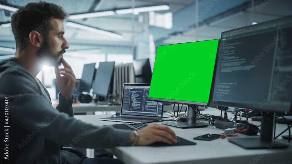 Poster Multi-Ethnic Office: White IT Programmer Working on Computer with Green Screen Chroma Key Display. Male Software Engineer Developing App, Program, Video Game. Terminal with Code Language.