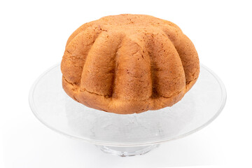 Low Pandoro, prepared to celebrate Christmas and New Year, on raised glass tray, isolated on white