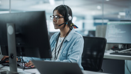 Call Center Office: Portrait of Friendy Indian Female IT Customer Support Specialist Working on...