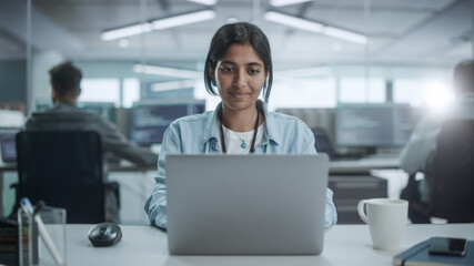 Diverse Office: Portrait of Beautiful Indian IT Programmer Working on Desktop Computer, Smiling. Female Software Engineer Creating Innovative App, Program, Video Game