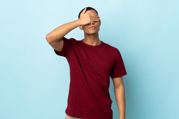 African American man over isolated background covering eyes by hands. Do not want to see something