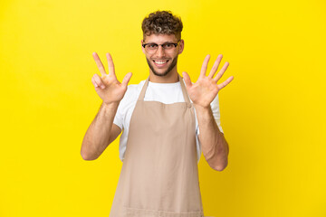 Restaurant waiter blonde man isolated on yellow background counting eight with fingers