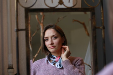 Fototapeta premium Portrait of a beautiful woman in the mirror