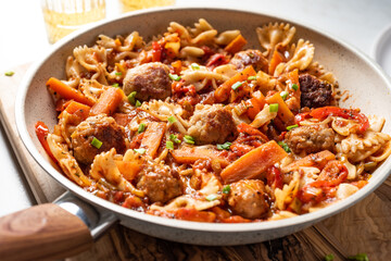 One pan dish. Pasta with onion, red pepper, garlic, tomatoes, carrot and meatballs.