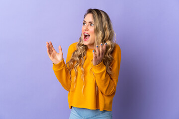 Young Brazilian woman isolated on purple background with surprise facial expression