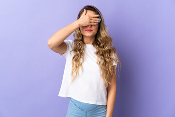 Young Brazilian woman isolated on purple background covering eyes by hands. Do not want to see something