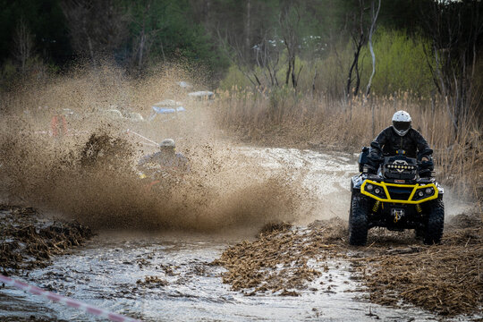 ATV and UTV rider driving in water hard road. Extreme offroad ride. 4x4.
