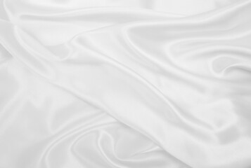 Smooth elegant white silk or satin luxury cloth texture as wedding background. Luxurious background design