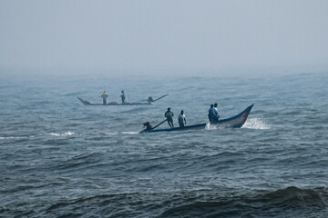 Naklejka premium boat in the sea, fishermen in boat, sea, morning sea, morning fishing 