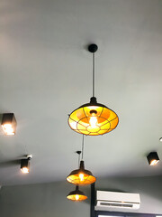 Traditional ceiling lamps or vintage metal lantern hanging from the ceilling of the shop.