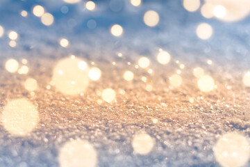 Macro texture of the snow surface with bokeh highlights, fabulous lighting effect and with a place for the inscription