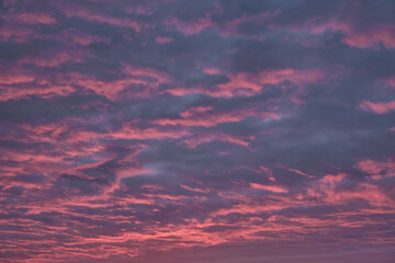 pink clouds in the sky before sunset