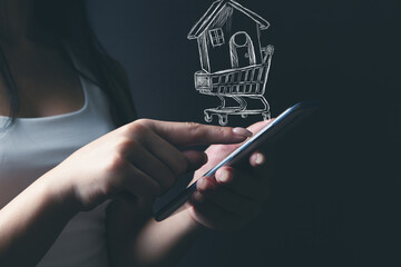 a woman is holding a hand-drawn house in a basket on the phone. buying a house