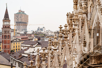 Spires of the Duomo against the backdrop of the city. Italy, Milan