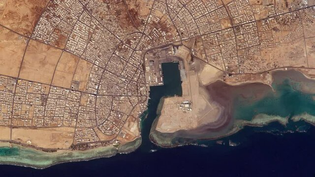 City architecture aerial satellite view from space, Yanbu Saudi Arabia on Red Sea coastline sunrise animation. Based on images furnished by Nasa