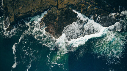 Big waves breaking over rocks