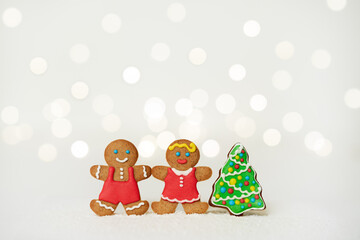 Christmas decorations with gingerbread man and woman on a white background.  Christmas background. Christmas tree