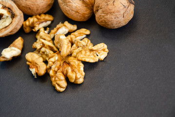 composition of walnuts close-up on a black background