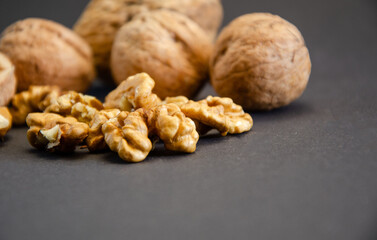 composition of walnuts close-up on a black background