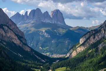 View of the Val Contrin valley with Sassolungo and Canazei in the background. Dolomites. South Tyrol. Italy.