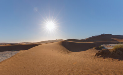 Fototapeta na wymiar Orange sand dune with blue sky - Sossusvlei, Namib desert, Namibia, Southern Africa