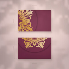 Burgundy business card with abstract gold ornaments for your personality.