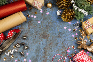 Christmas banner frame ith wrapping paper, ribbons, jingle bells, Christmas gifts and other decorations. Plenty of copyspace for your text in the center for seasonal greetings