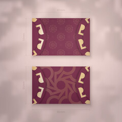 Burgundy business card with antique gold pattern for your personality.