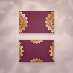 Burgundy business card with luxury gold pattern for your brand.