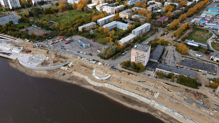 Aerial, Red and Yellow Trees, City, River in Late Gold Autumn, Russia, Komsomolsk-on-Amure 	
