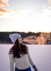 woman, girl sees breath in cold air
