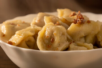 A plate of hot dumplings on the table