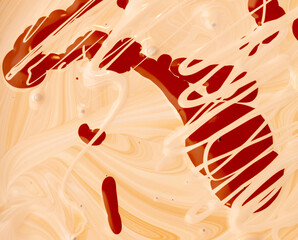 Mixing of red and white water-based paint.