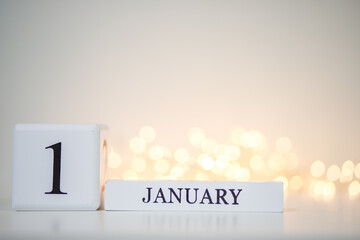 Abstract background, desktop cube calendar with the date - January 1, the designation of the...