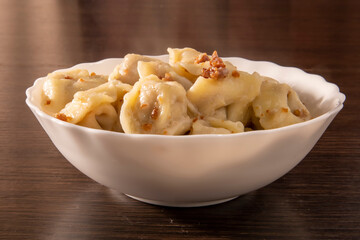 A plate of hot dumplings on the table