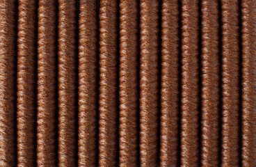 Wafer rolls background. Chocolate wafer roll sticks lies in line and fill the whole frame of picture. Crispy dessert background concept. Close up