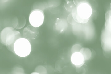 Golden ball on decorated Christmas tree with blurred lights bokeh. Wide panoramic holiday banner with white copy space