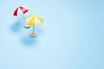Yellow and red umbrella on a blue background.