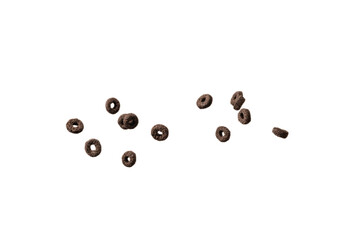 Chocolate rings cereal spill out into a bowl. Breakfast.