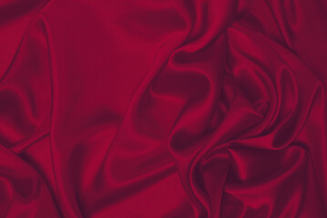 Rich and luxury red silk fabric texture background.