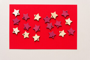 wooden star shapes on red paper