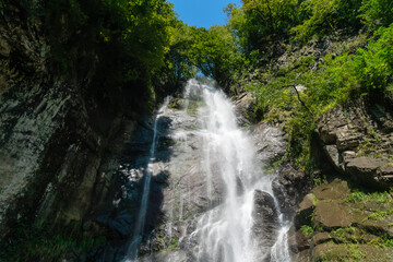 Mahuntseti Waterfall on a sunny, bright day. Georgia. Sights of Georgia