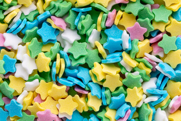Colorful Sugar Star Sprinkles Background.