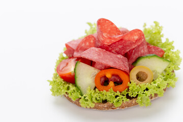 Sandwich with salami sausage on white background.
