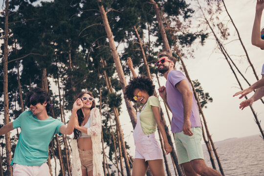 Photo of sweet funky young six friends wear casual clothes dancing smiling outside countryside