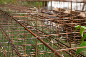Concrete reinforcement with wire-connected metal rods. Preparation for pouring foundations