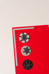 wooden snowflakes on paper